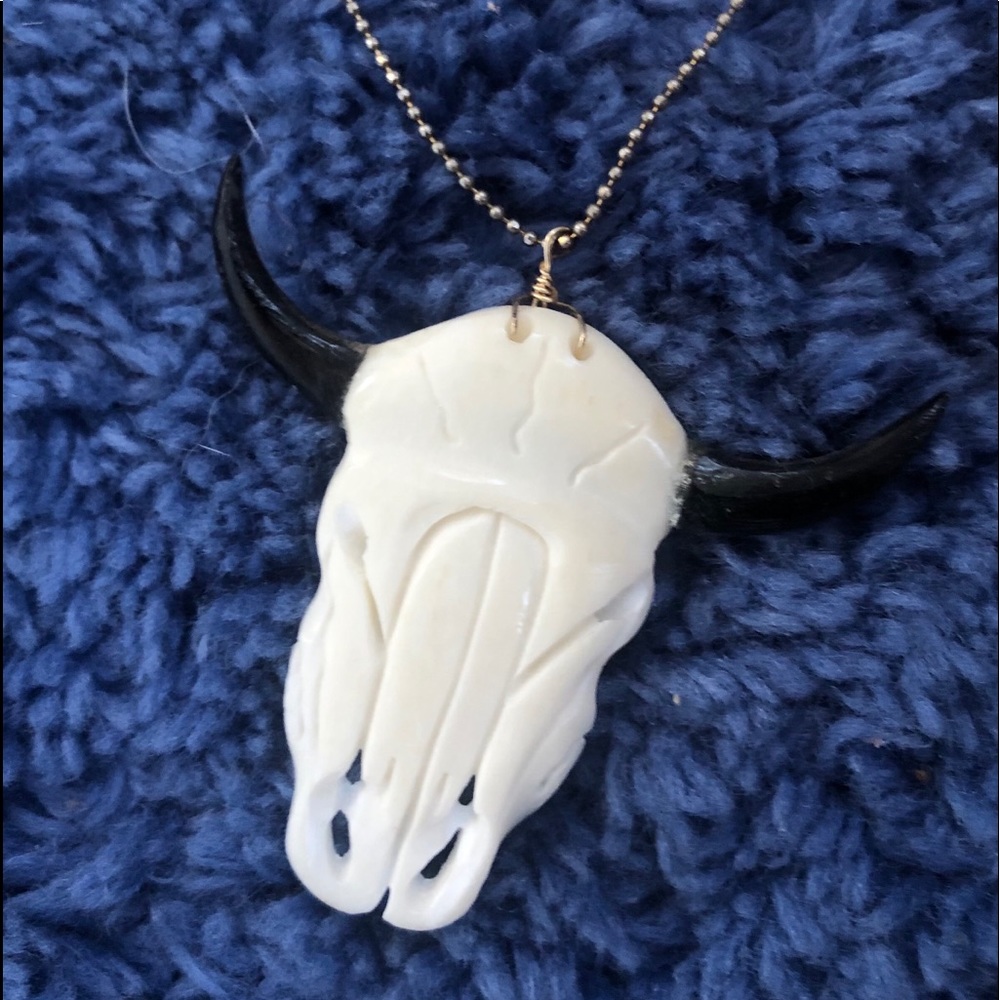 Hand carved bull pendant necklace